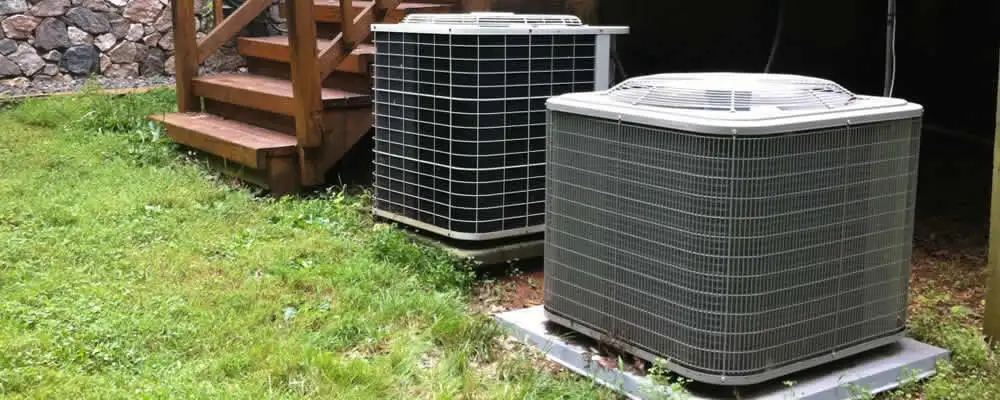 Heat pump installation and service units outside a home in Bloomington, IN